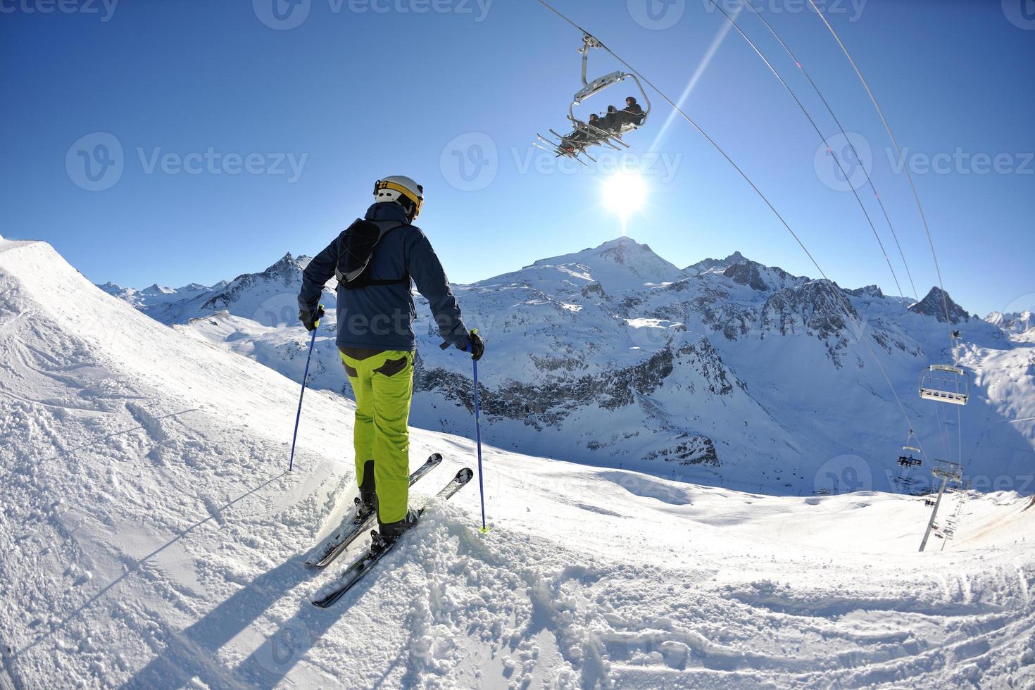 skiing on fresh snow at winter season at beautiful sunny day photo