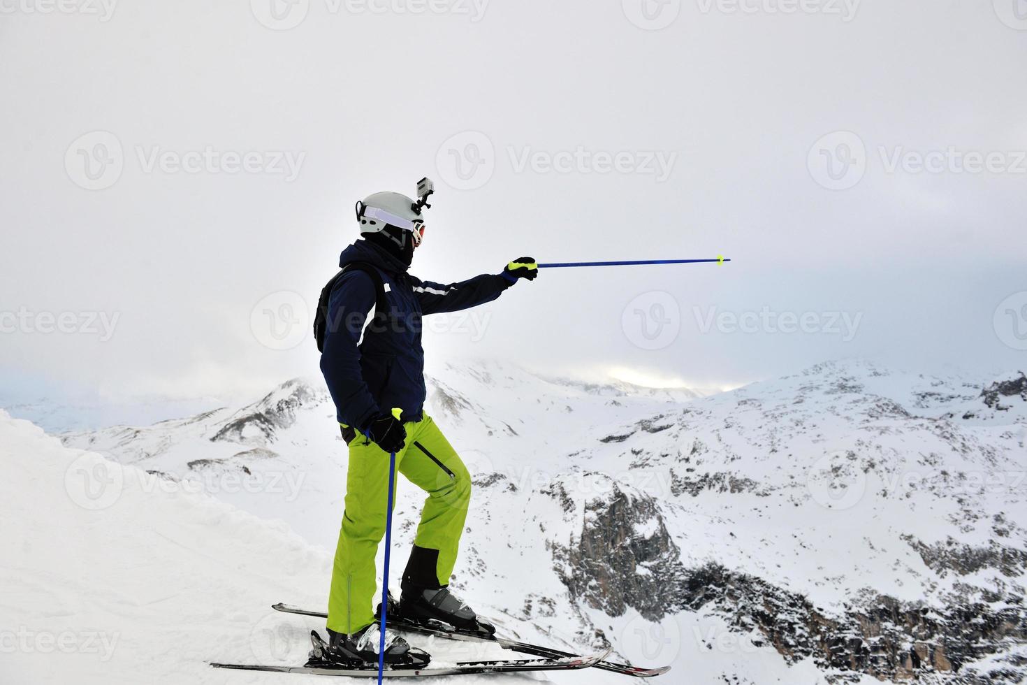 skiing on fresh snow at winter season at beautiful sunny day photo