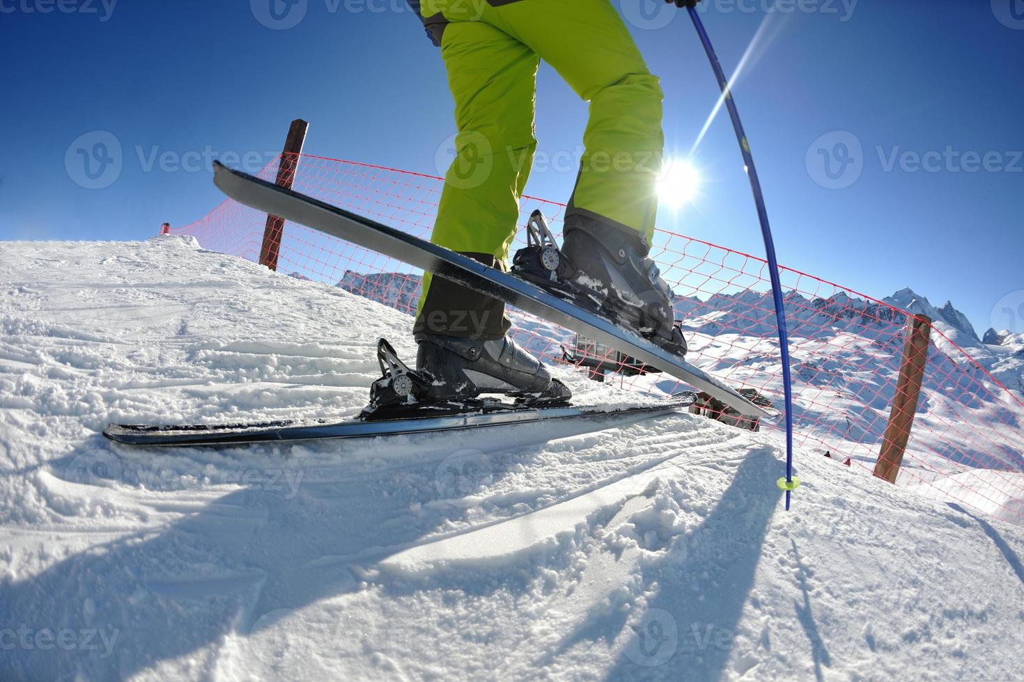 skiing on fresh snow at winter season at beautiful sunny day photo