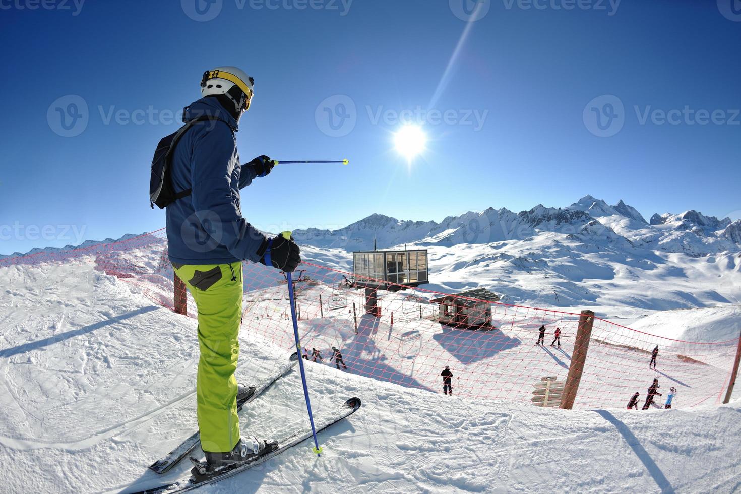 skiing on fresh snow at winter season at beautiful sunny day photo