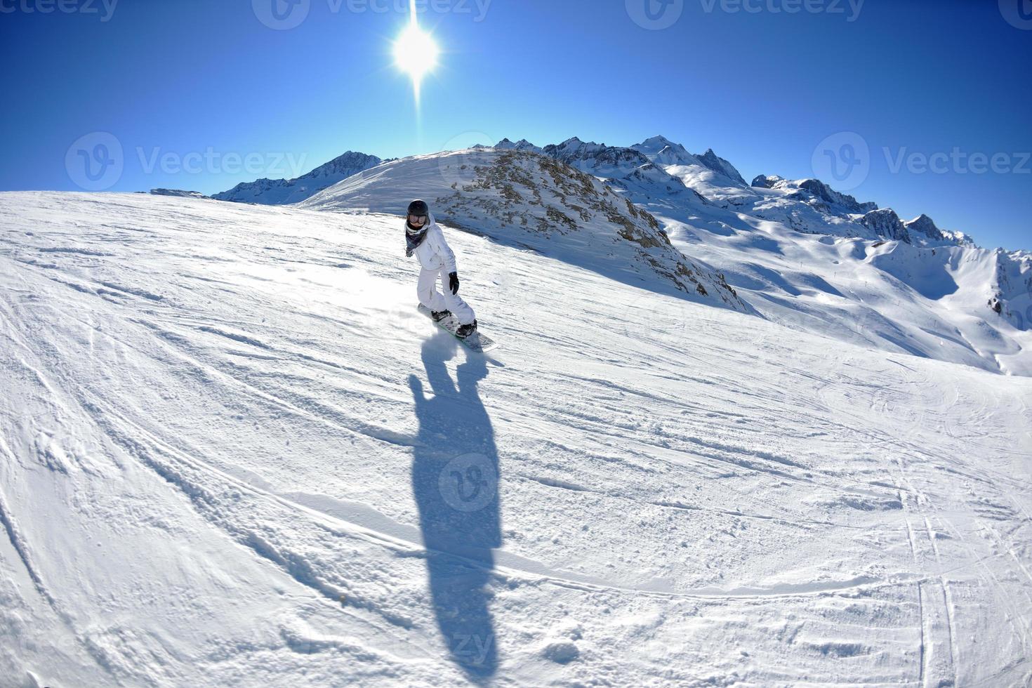 skiing on fresh snow at winter season at beautiful sunny day photo