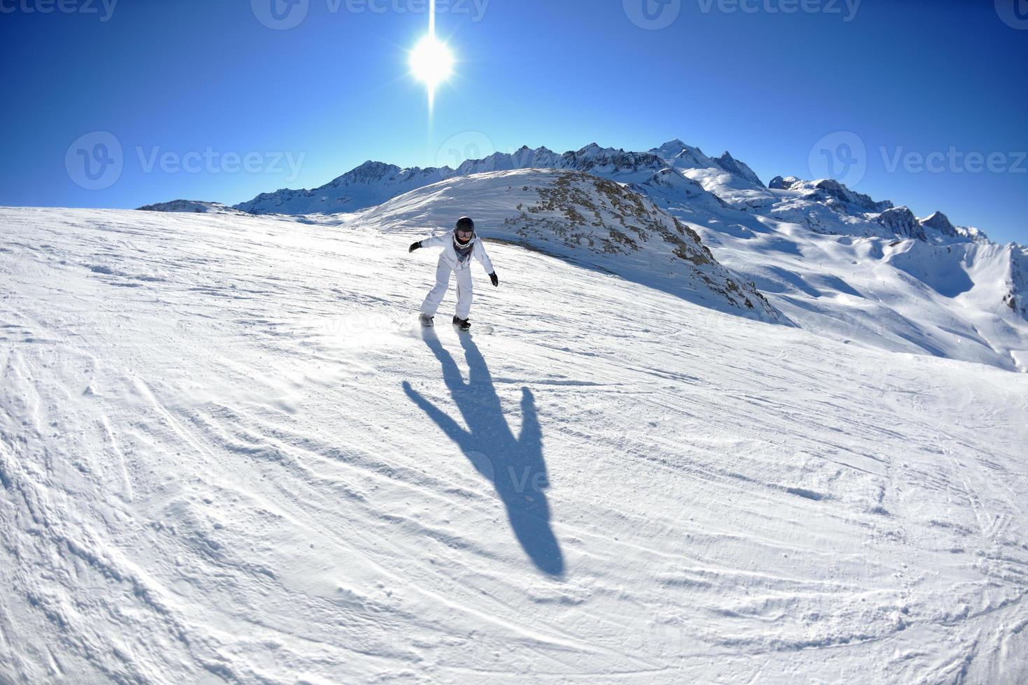 skiing on fresh snow at winter season at beautiful sunny day photo