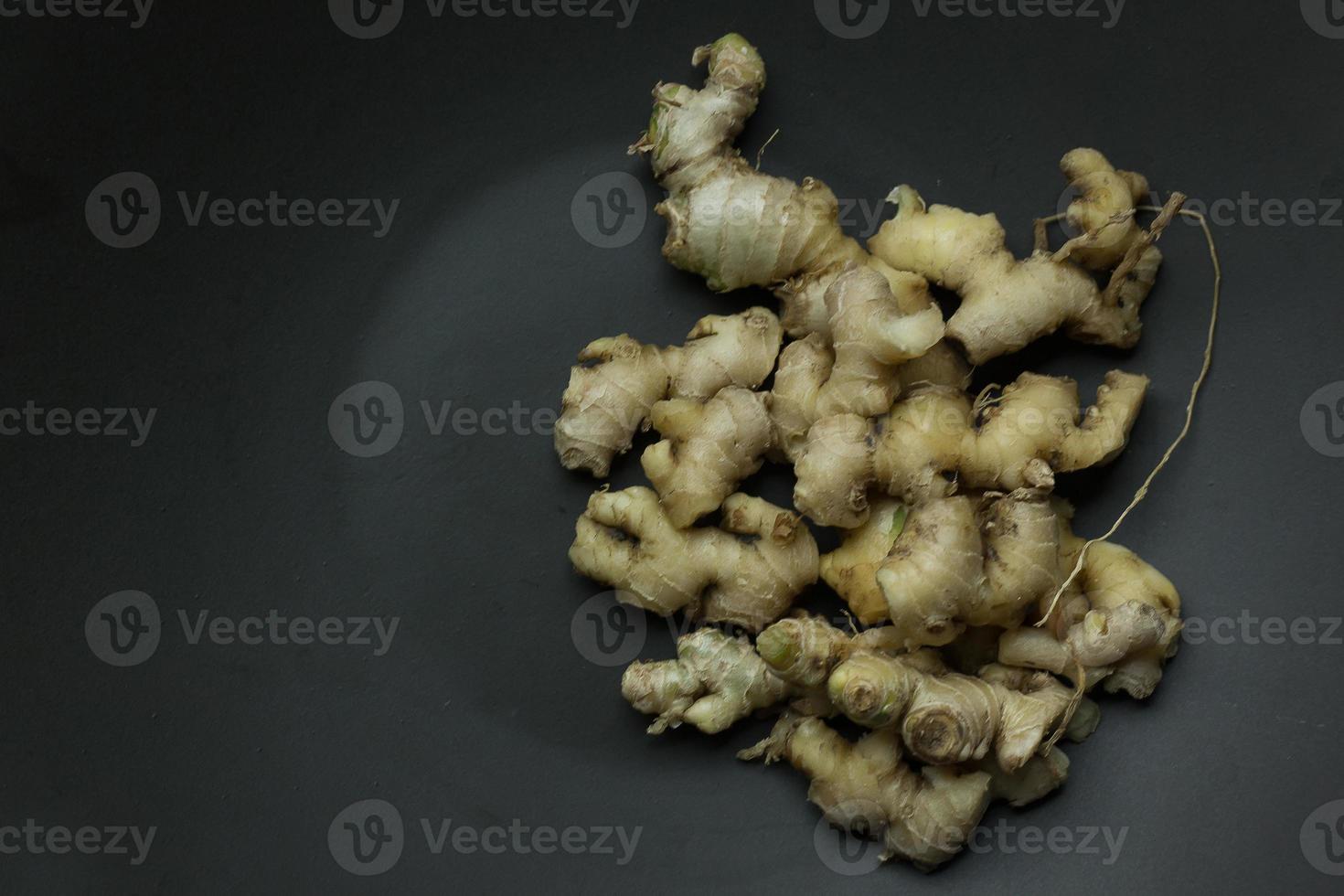 Ginger on black plate for food content. photo