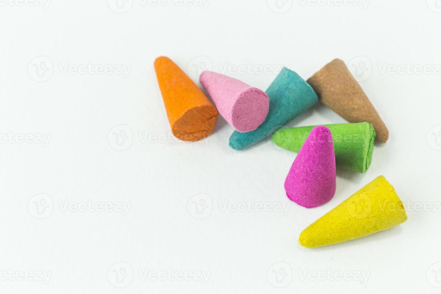 Incense Cone in a stand with the feather for background. photo