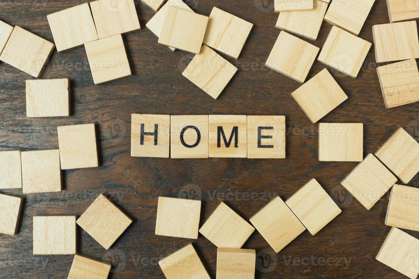 Home word on wood plate abstract background. photo