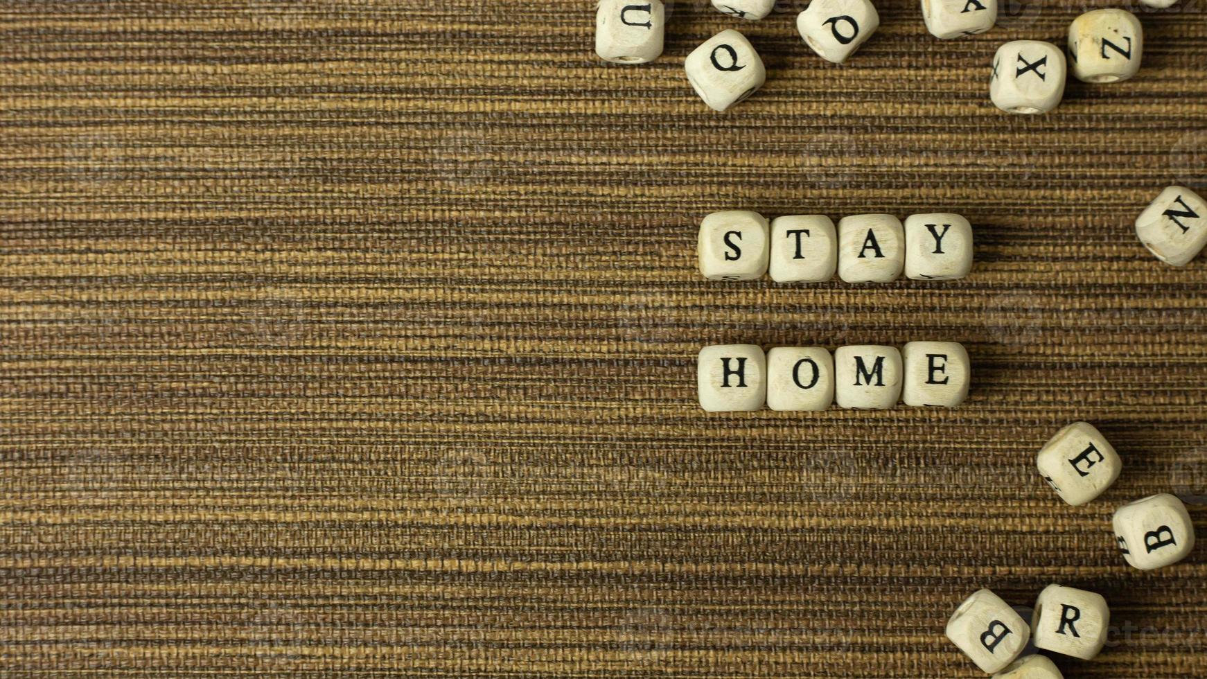 stay home on wood cube for social distancing content. photo
