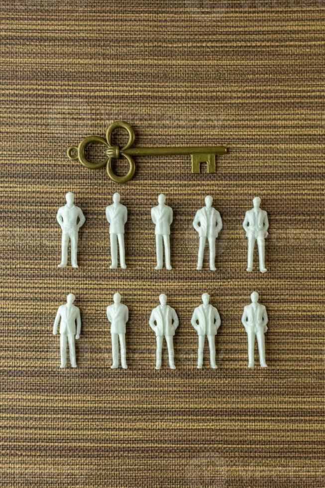 white figure miniature  on wood for business content. photo