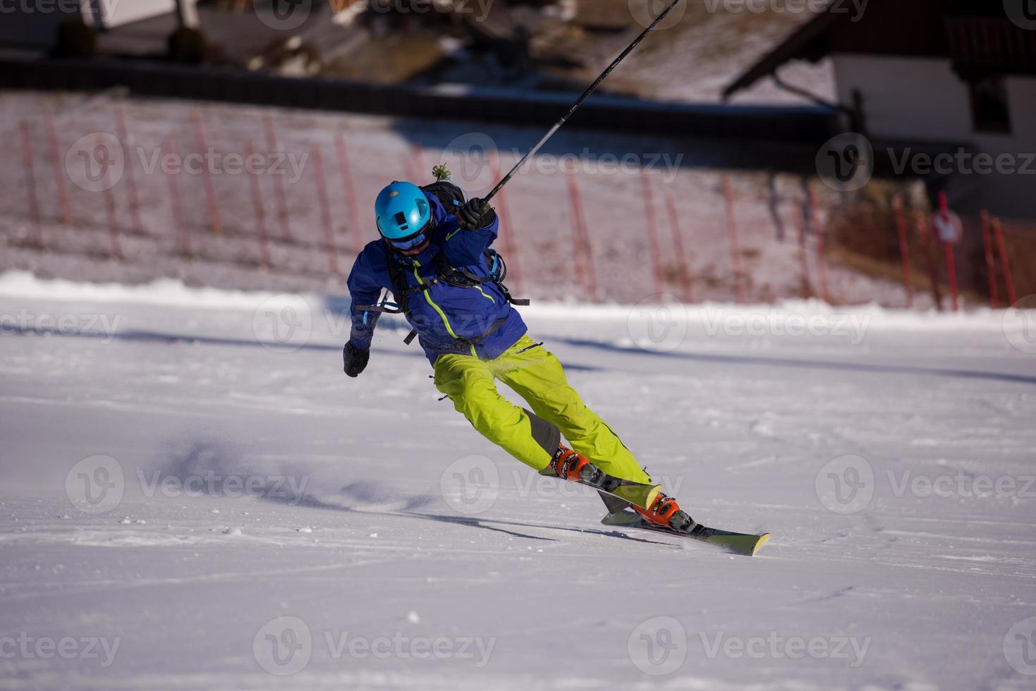 Skier having fun while running downhill photo