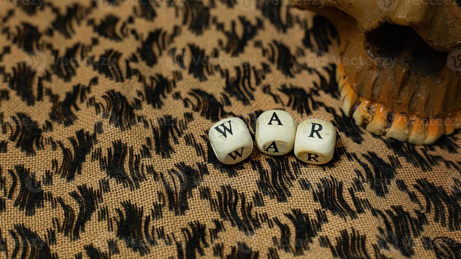 war on wood cube  on  shemagh  for  military content. photo