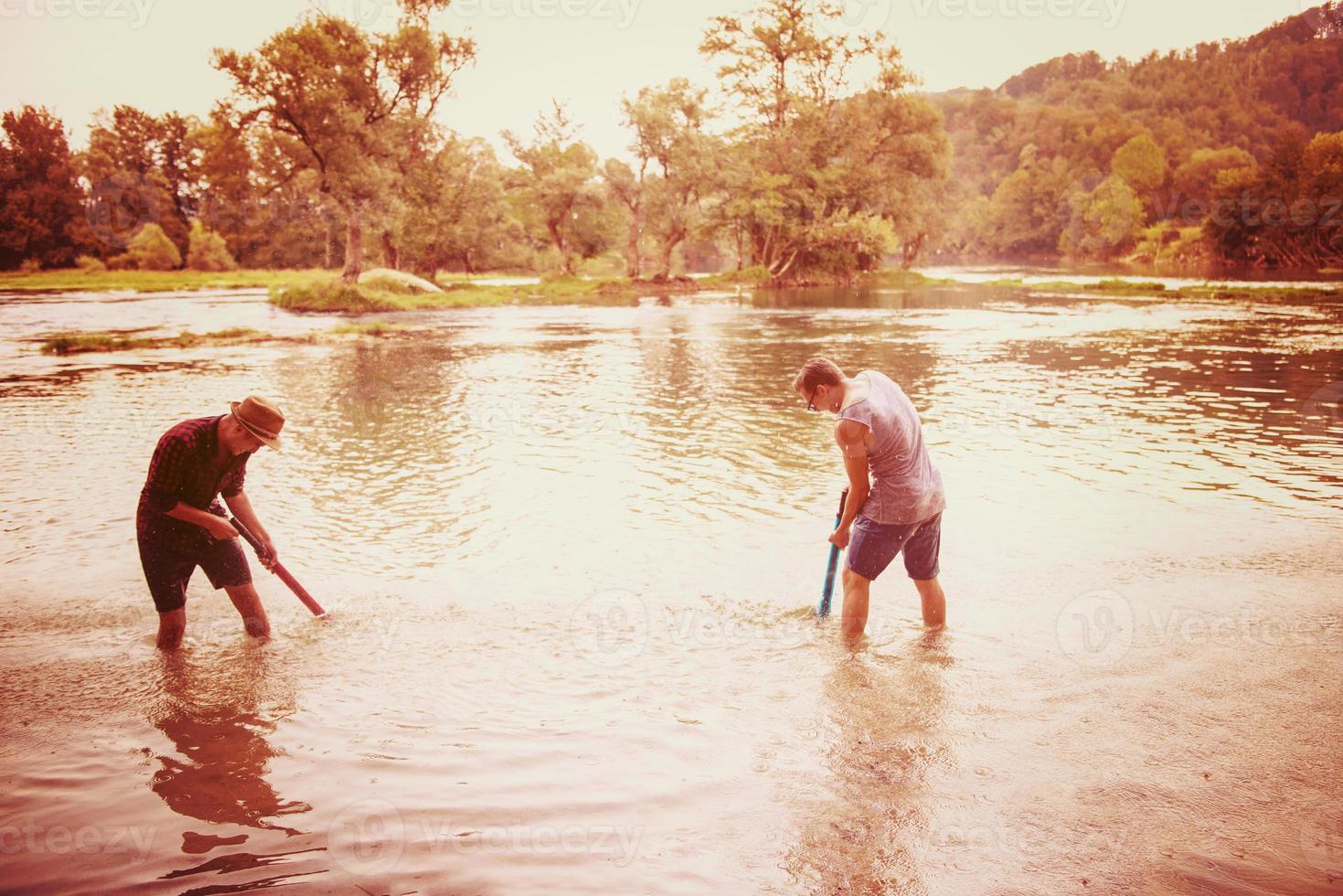 young men having fun with water guns photo