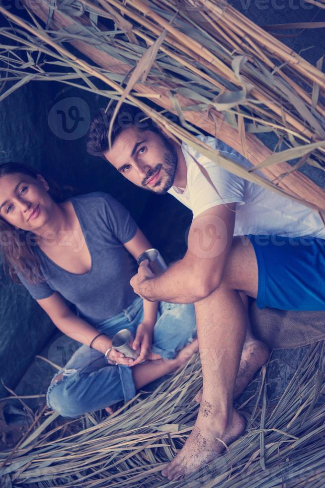 couple spending time together in straw tent photo