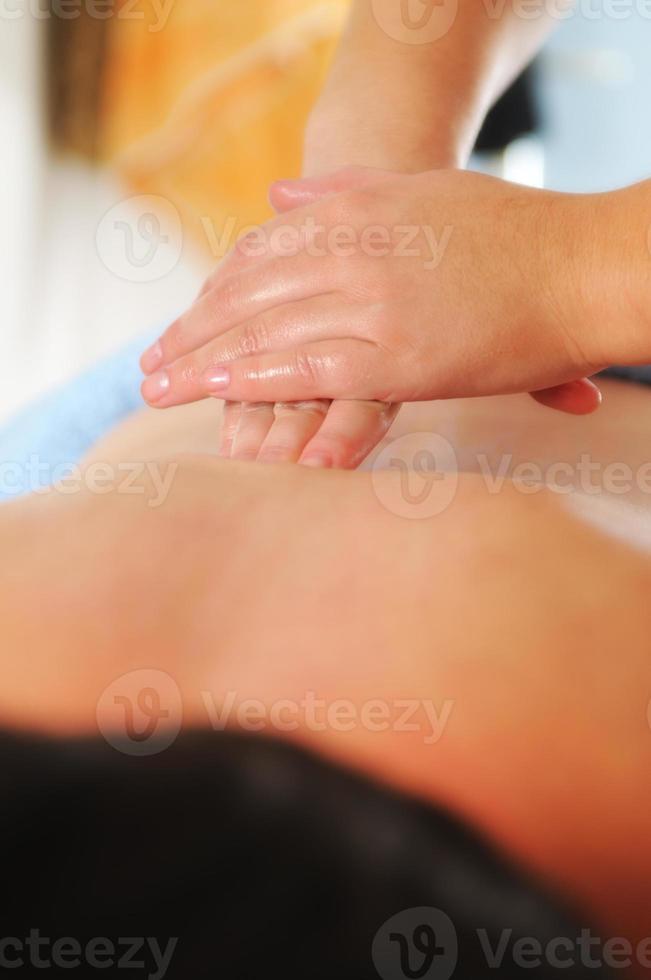 back massage at the spa and wellness center photo