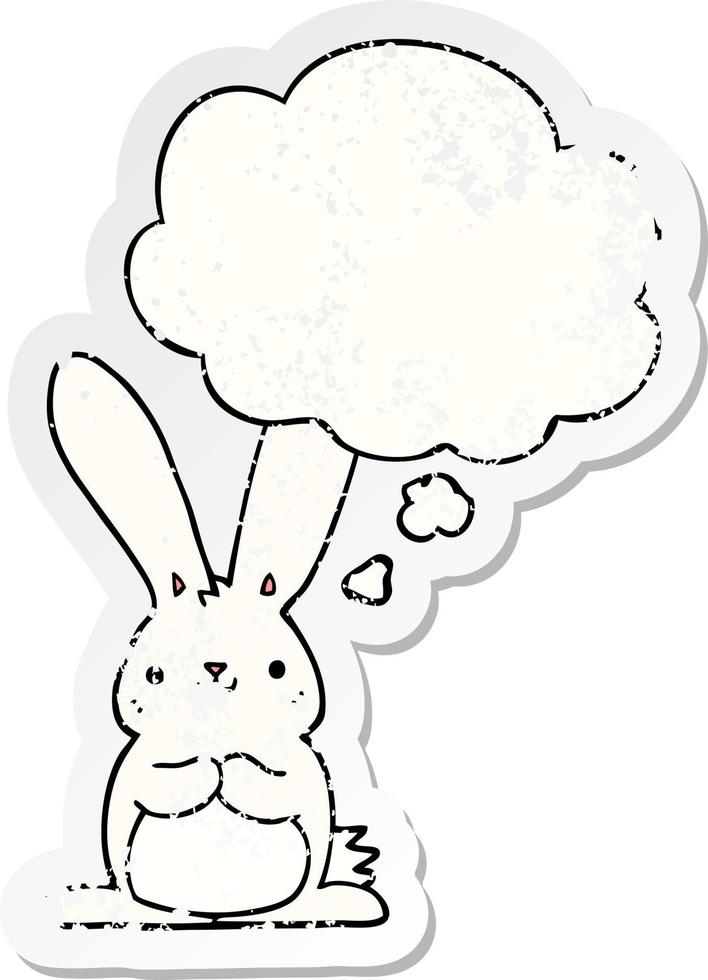 cartoon rabbit and thought bubble as a distressed worn sticker vector