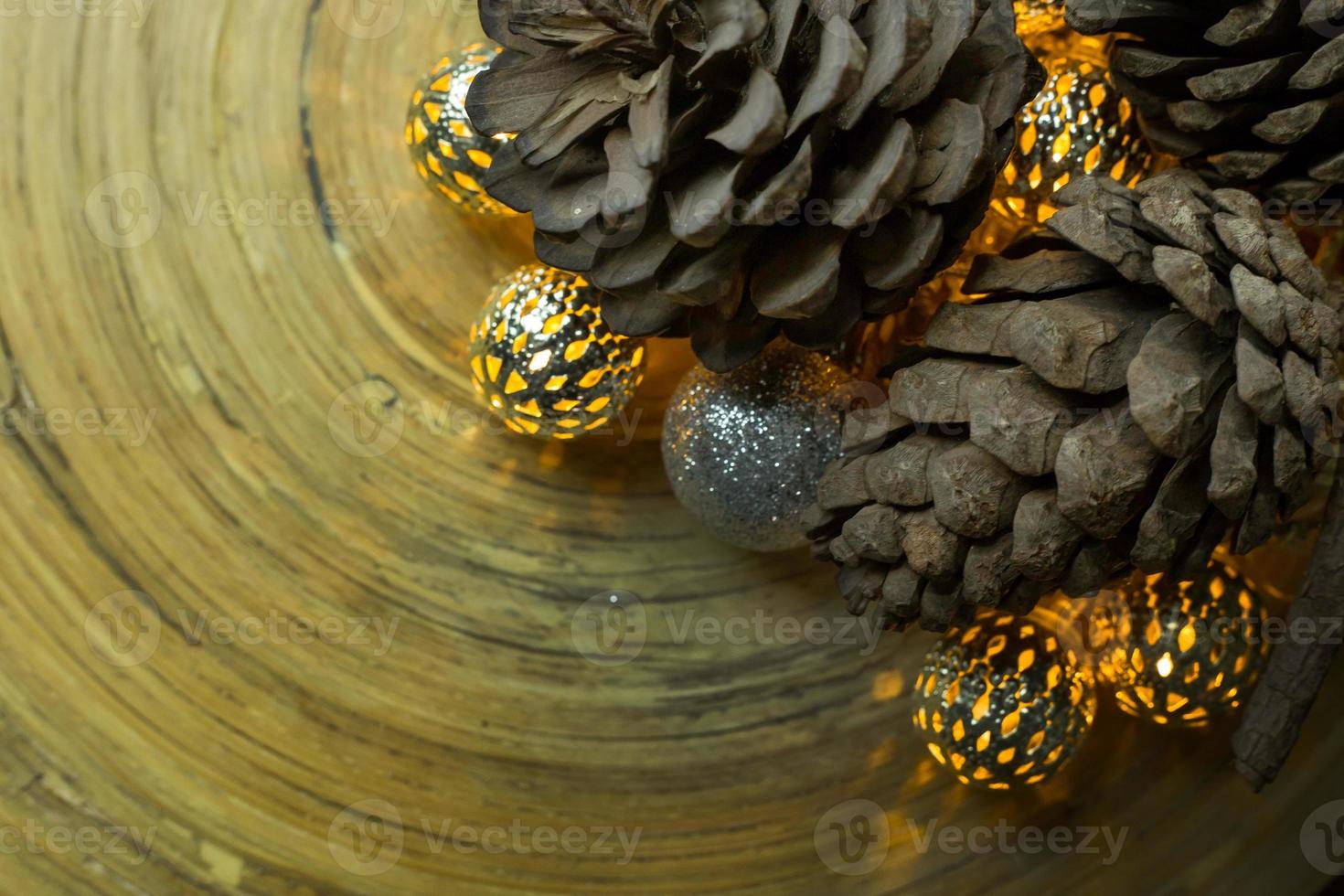 christmas ball and Pine cones  on wood  background. photo