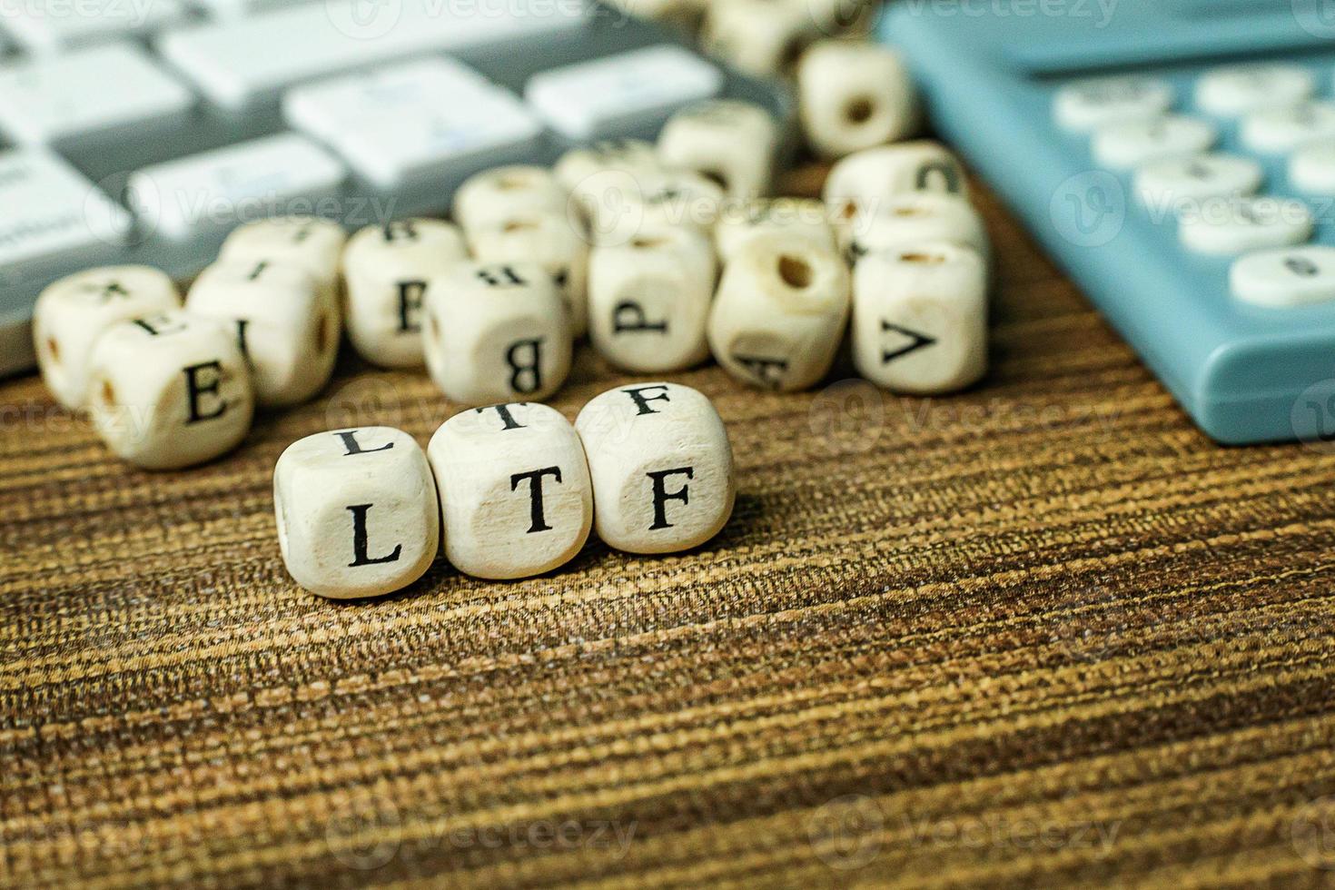 Text LTF on wooden cube image  for business content. photo