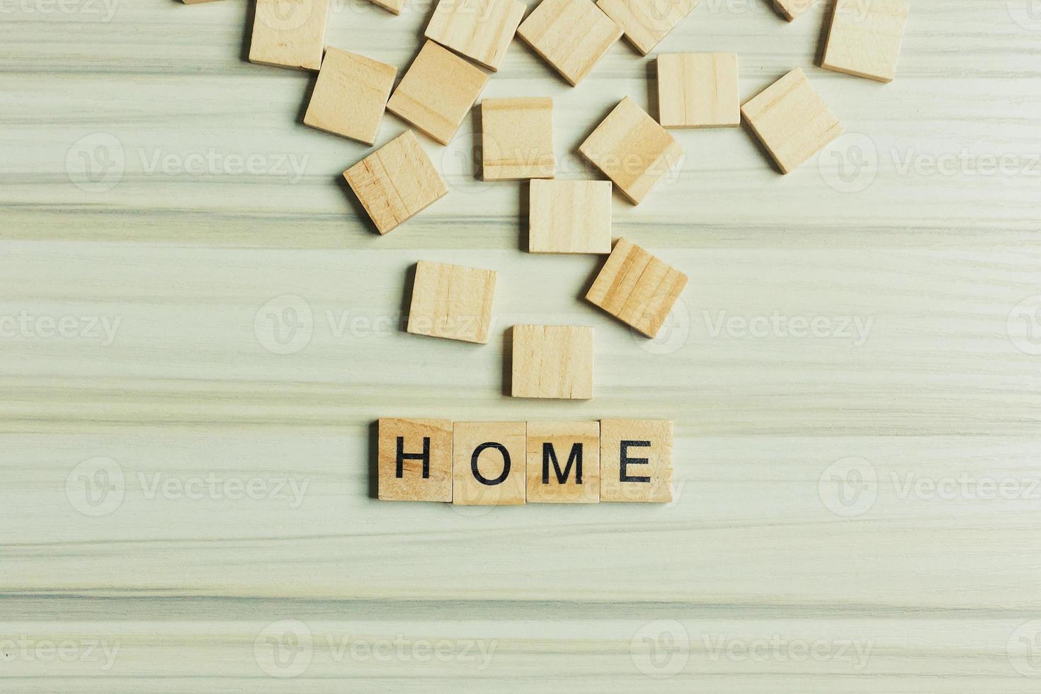 Home word on wood plate abstract background. photo