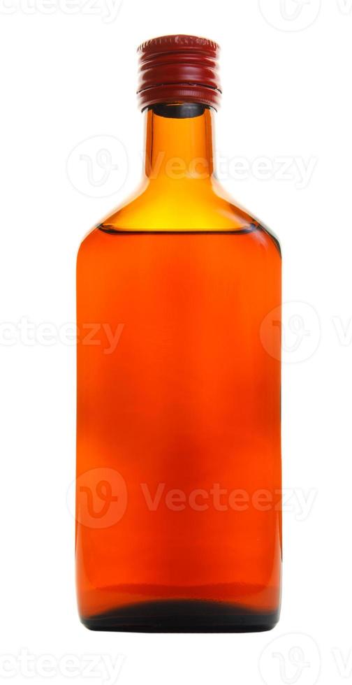 The beautiful glass bottle is isolated on a white background. photo