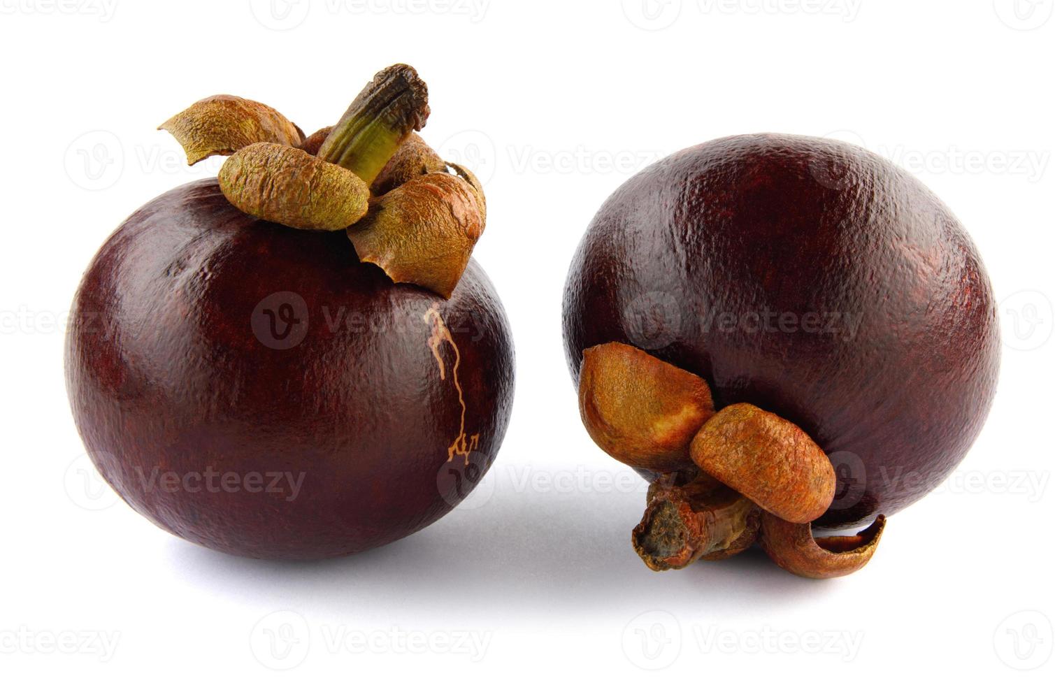 Two ripe mangosteen isolated on a white background. photo