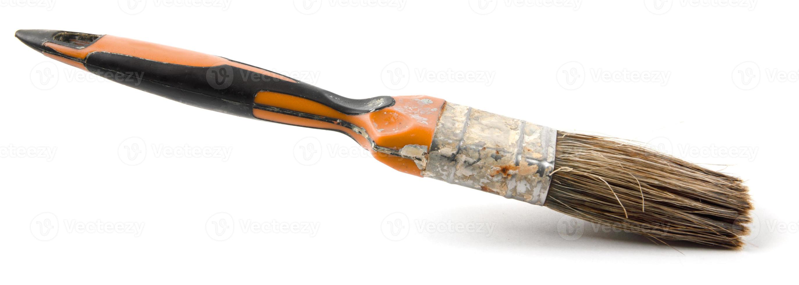 The old painting brush is isolated on a white background. photo