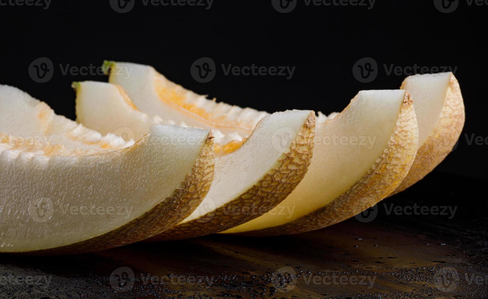 A row of ripe juicy melon lobes. photo