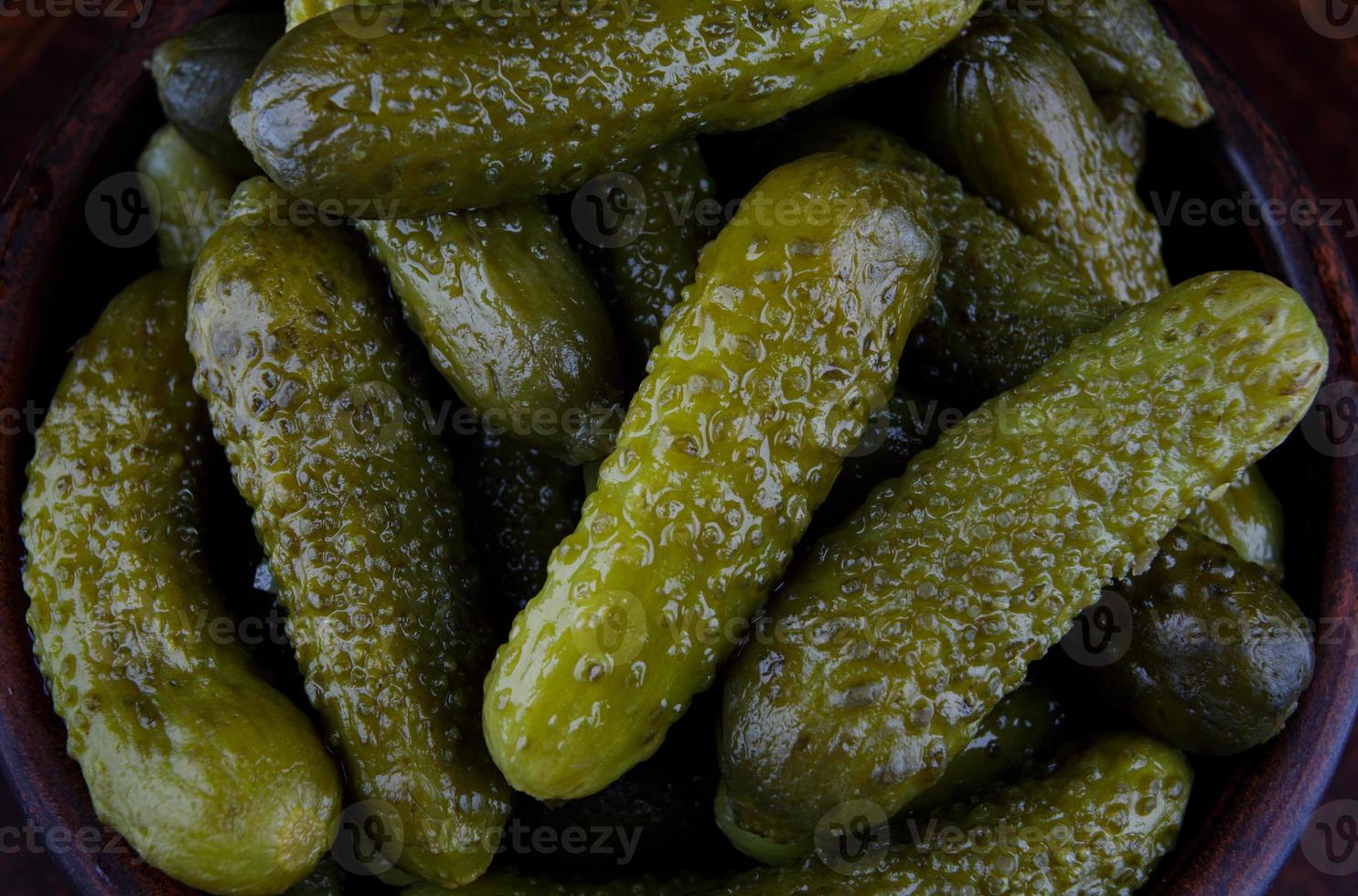 Background of a lot of pickled cucumbers. Salted cucumbers. photo