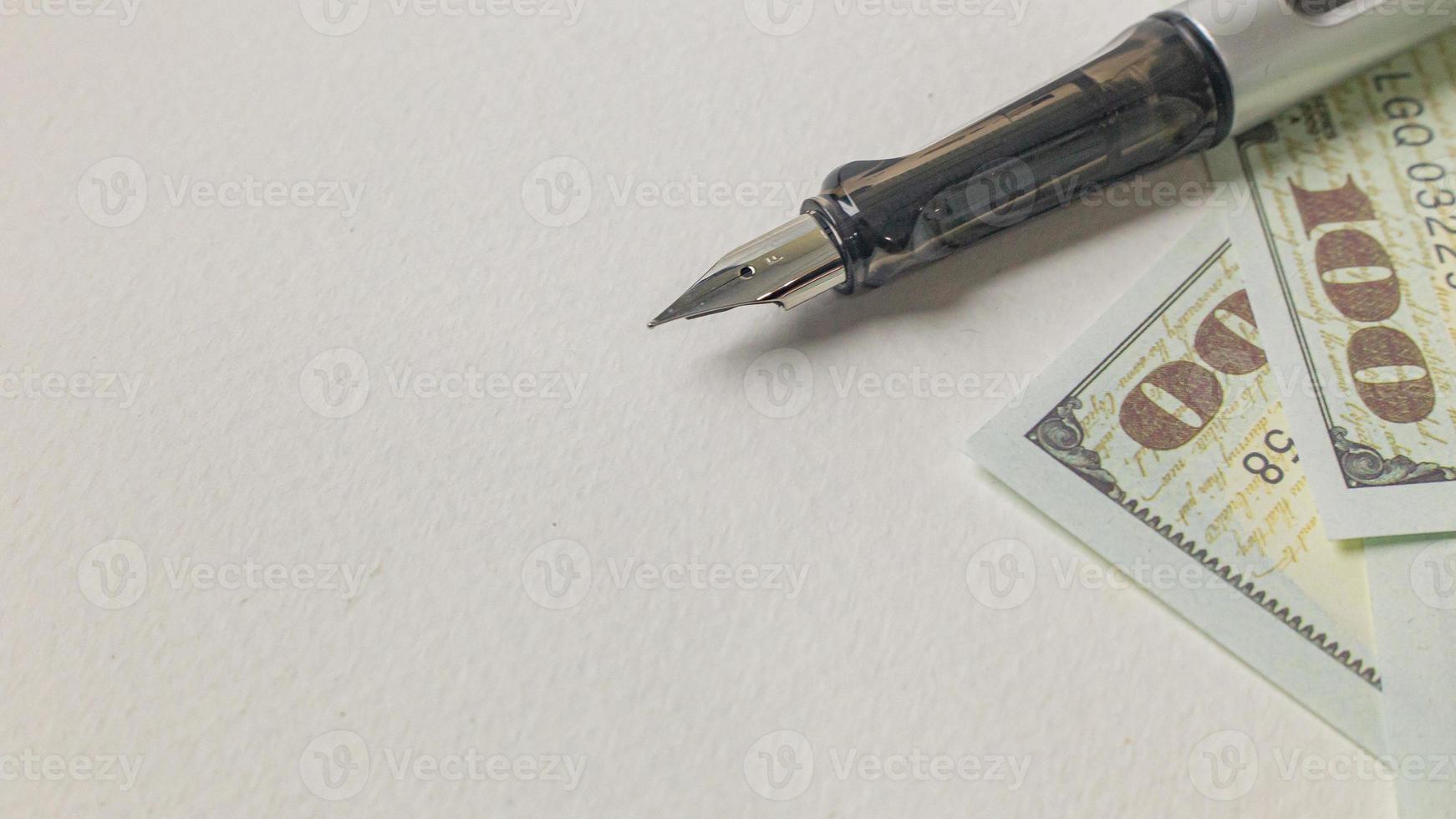 pen and banknotes image for business concept. photo