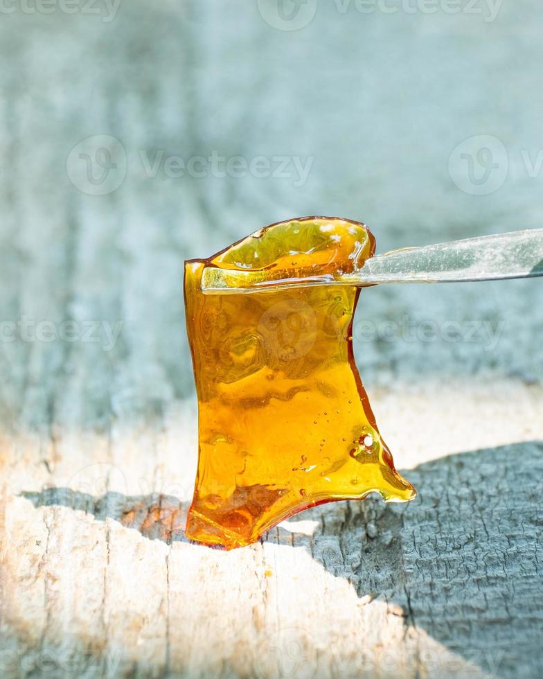 marijuana wax smear, cannabis dab with stick photo