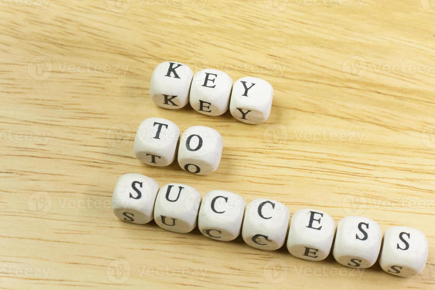 concept key to success on  wood cube for background. photo