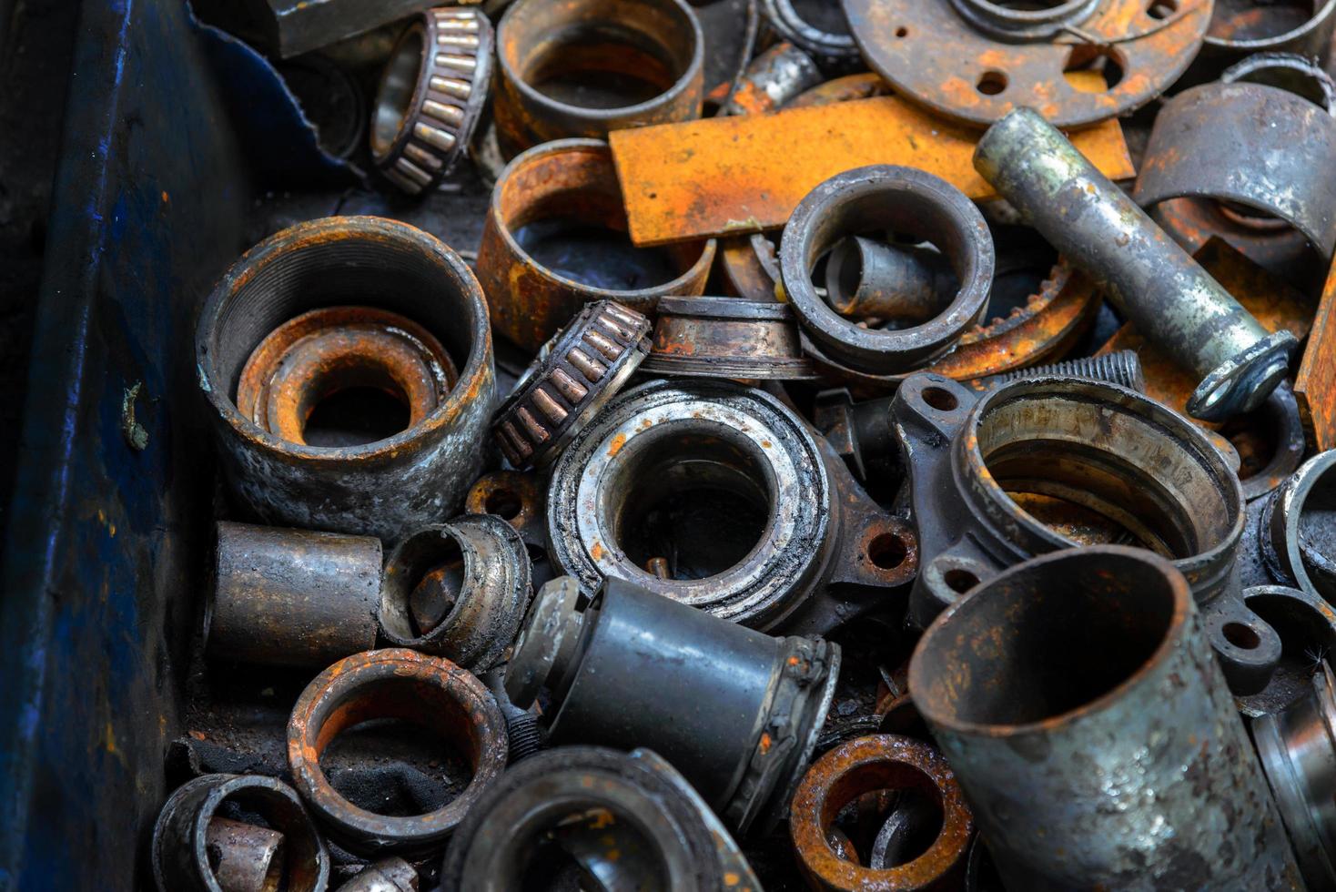 Useless, worn out old rusty car engine and other parts photo