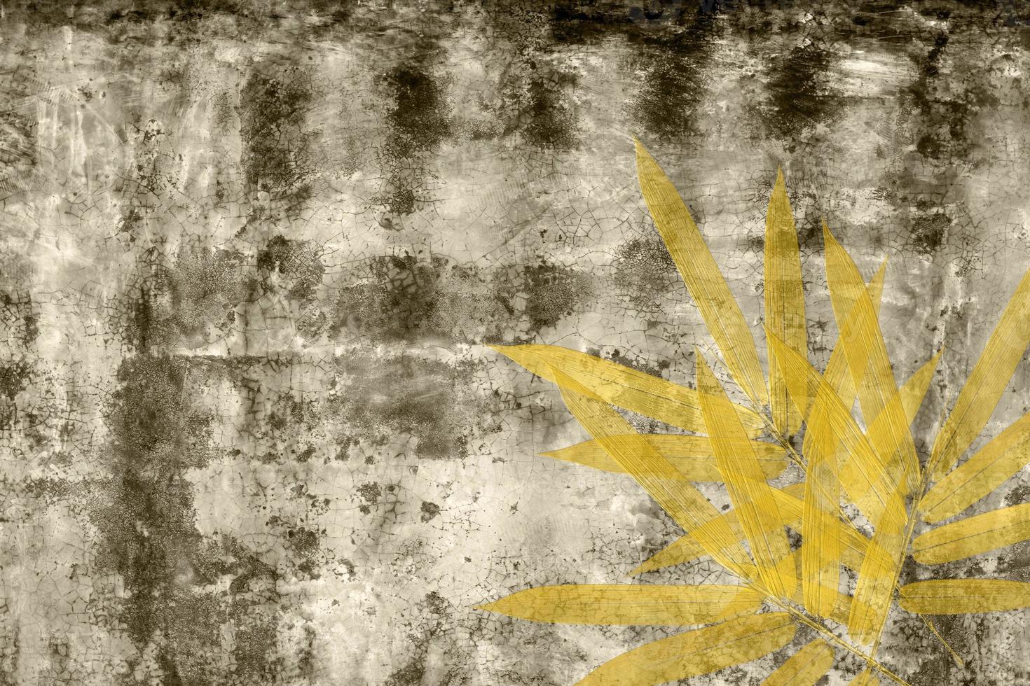 golden bamboo leaves on gray cement texture,Abstract background photo