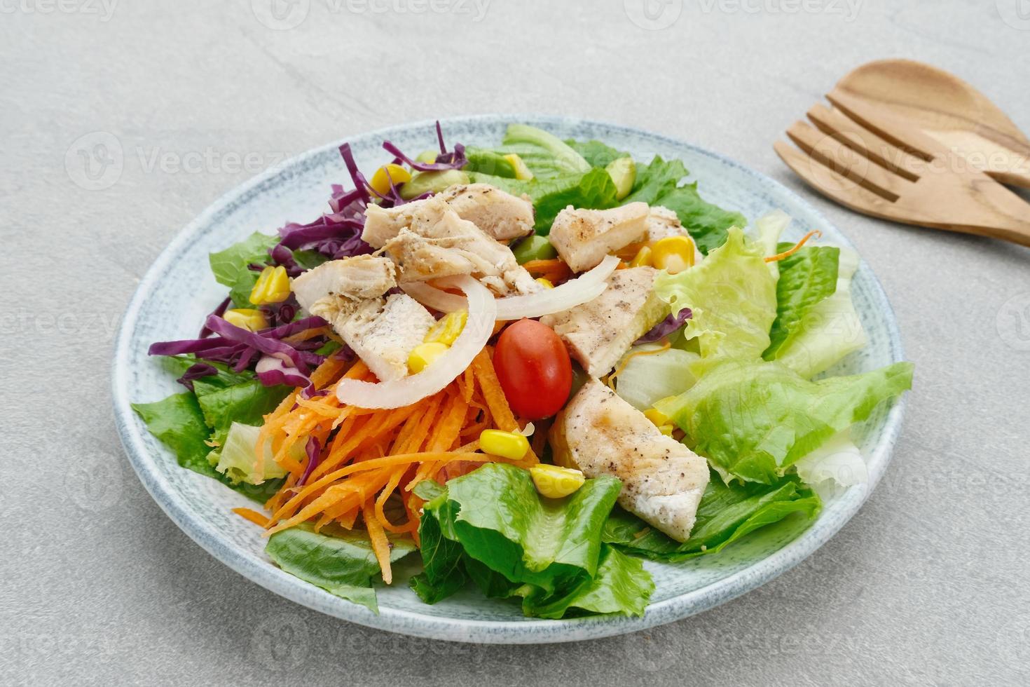 Green salad from green leaves mix vegetables, potatoes and roasted chicken with mayonnaise sauce. photo
