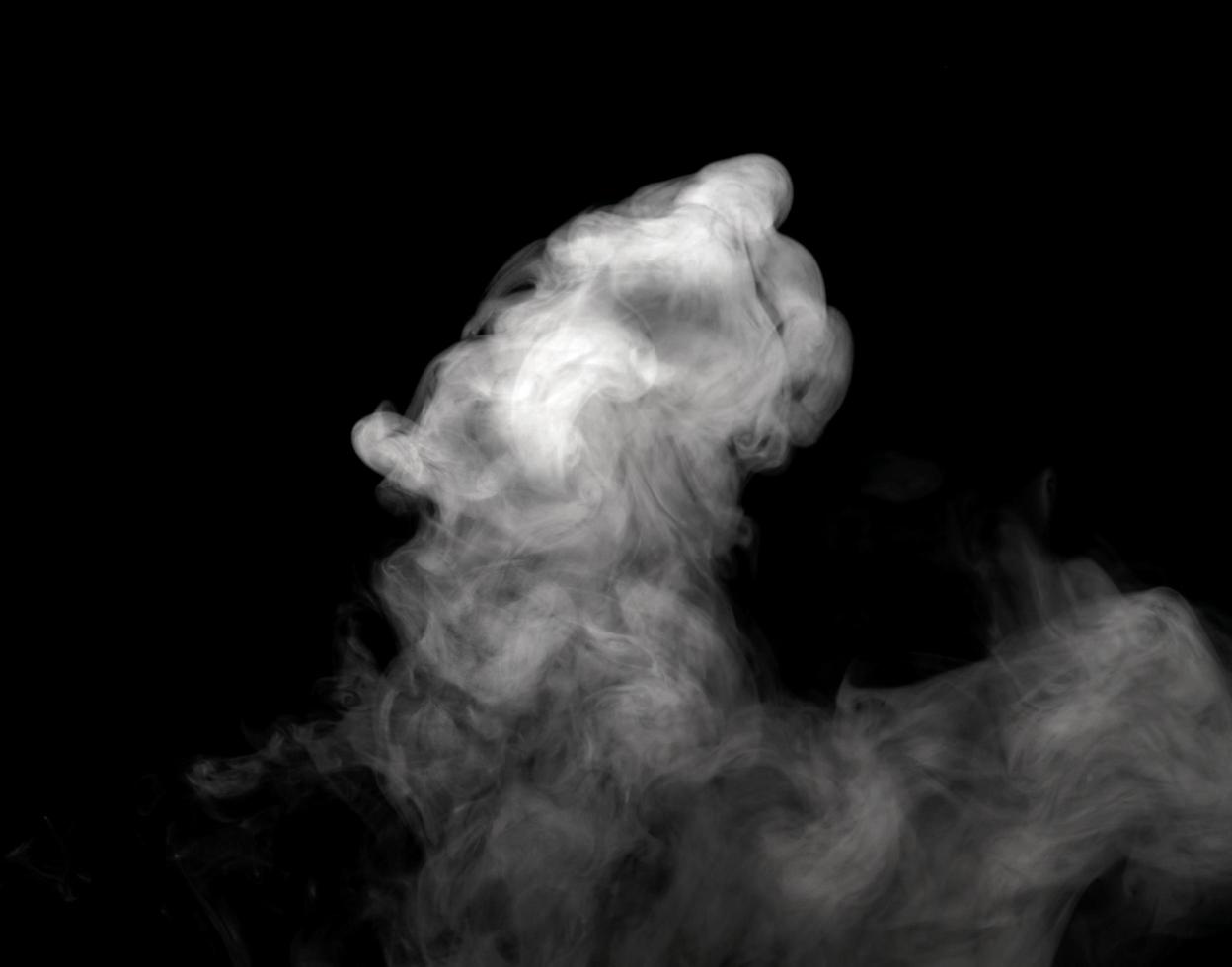 Abstract powder or smoke effect isolated on black background photo