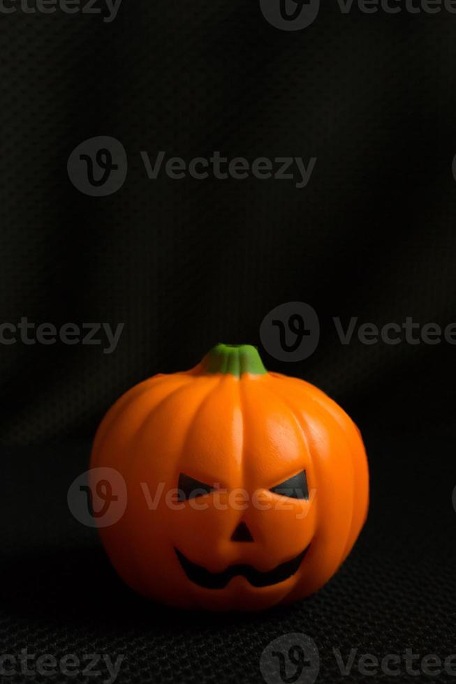 The halloween pumpkin jack in black holiday background image. photo