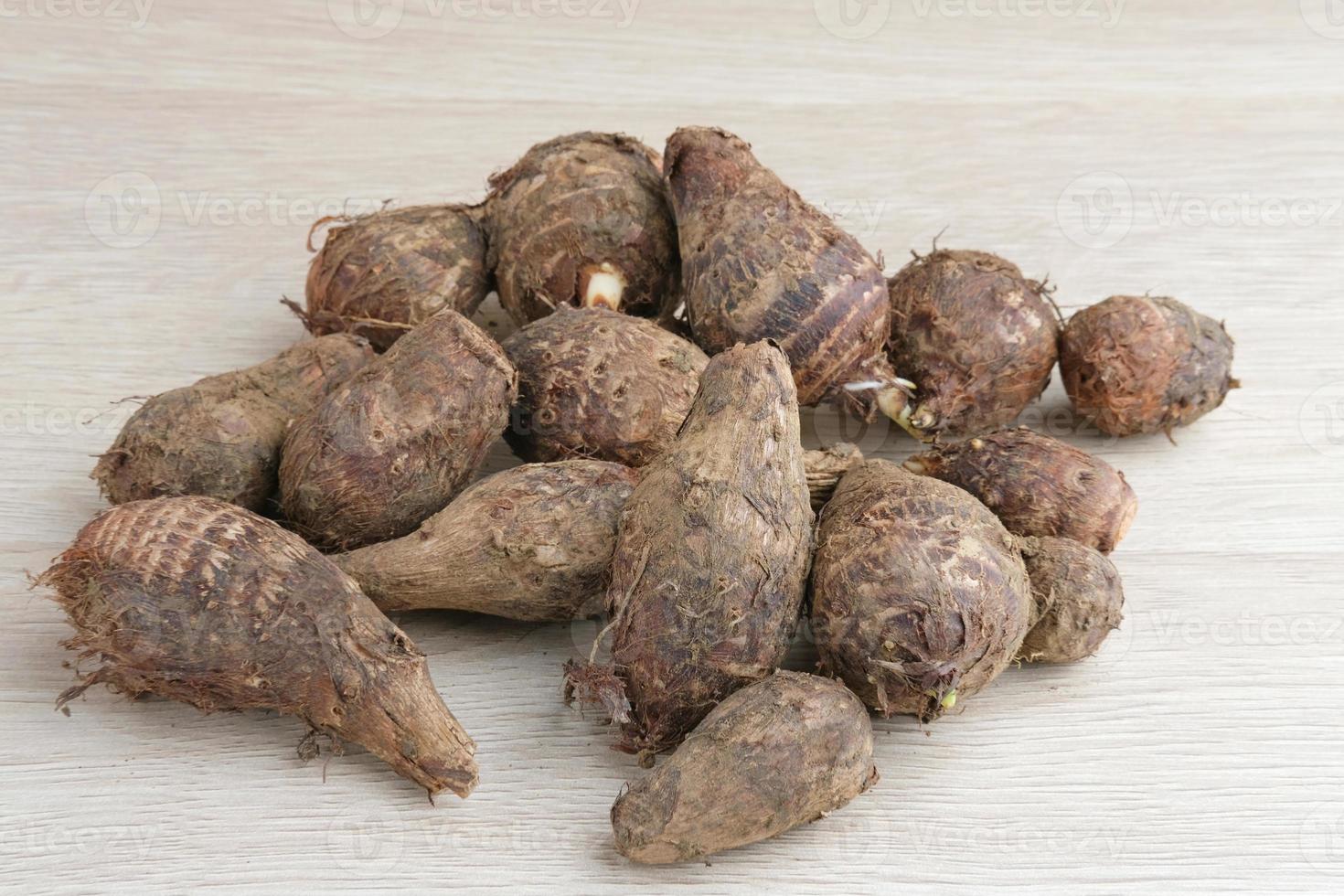 Taro, Talas belitung, kimpul or bentul, are starchy tubers that can be eaten. Served boiled or steamed. photo
