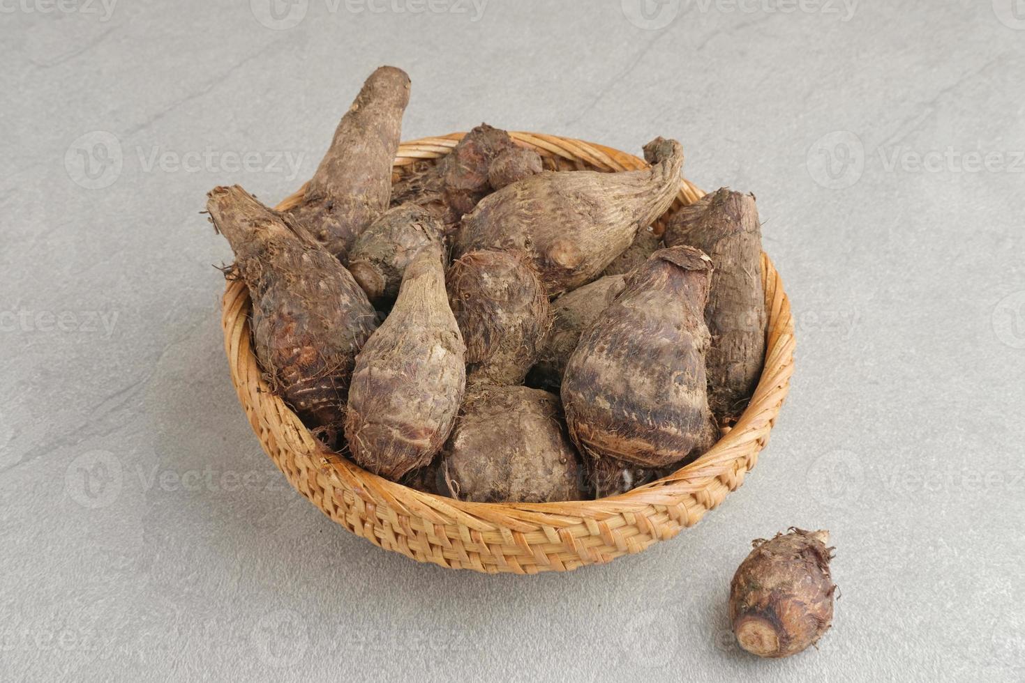 Taro, Talas belitung, kimpul or bentul, are starchy tubers that can be eaten. Served boiled or steamed. photo