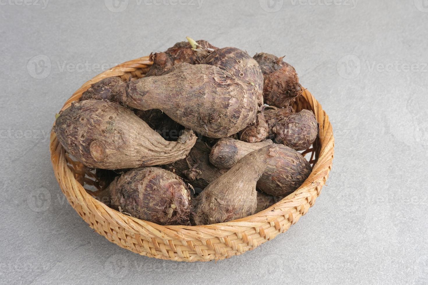 Taro, Talas belitung, kimpul or bentul, are starchy tubers that can be eaten. Served boiled or steamed. photo