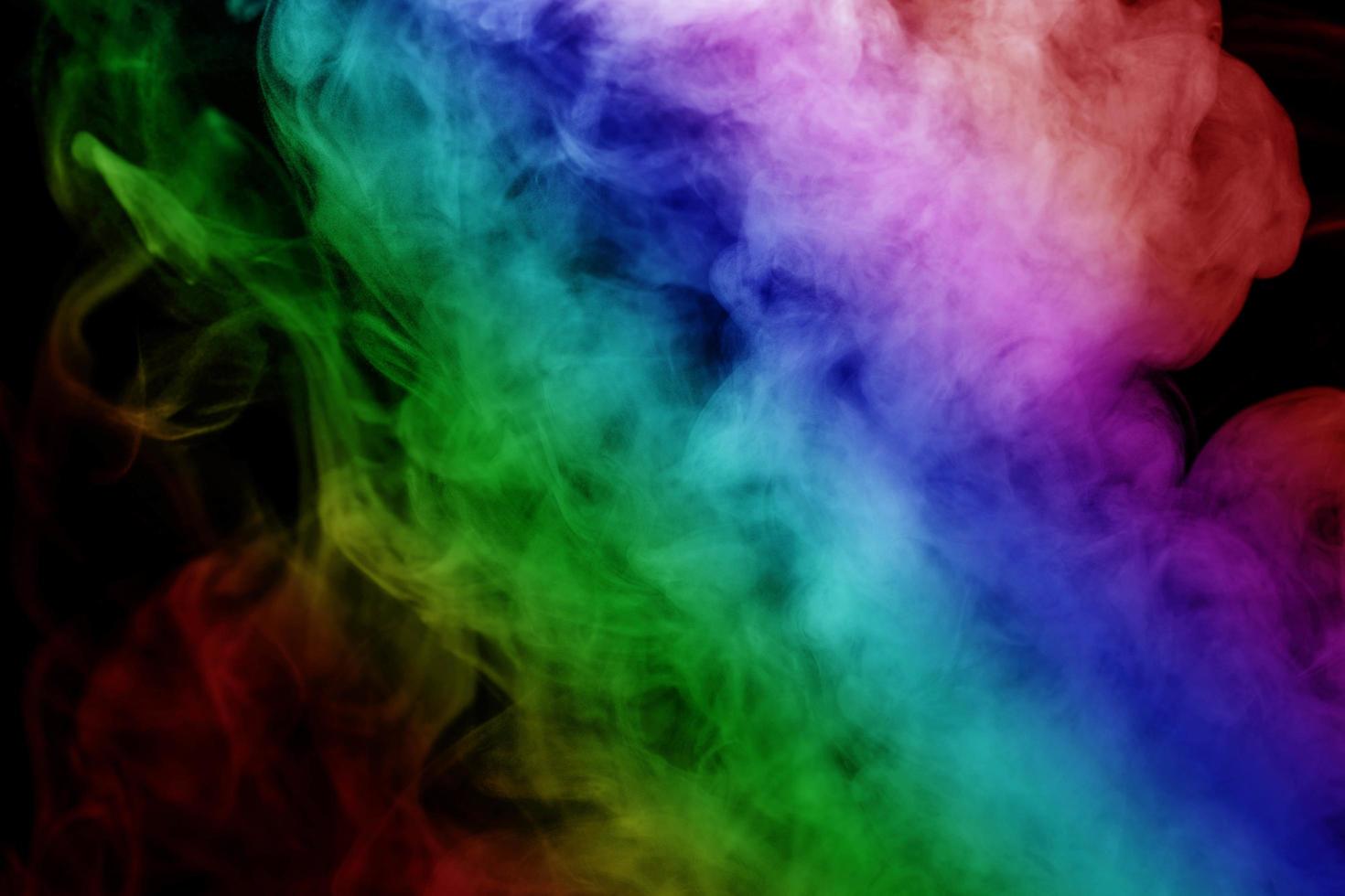 Abstract smoke isolated on black background,Rainbow powder photo