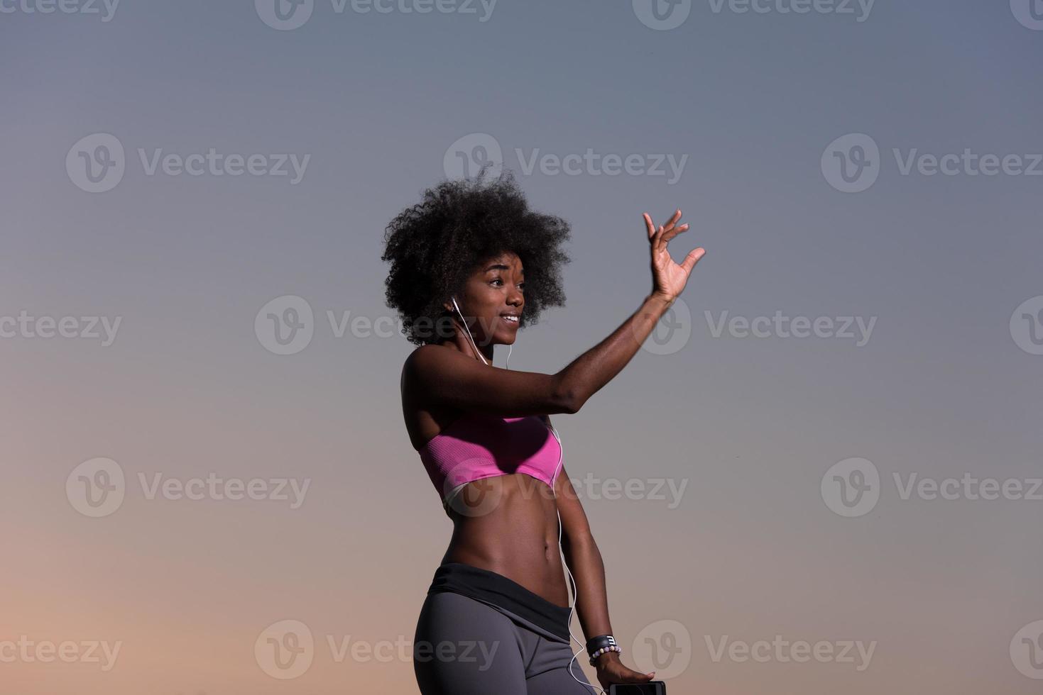 young black girl dances outdoors photo