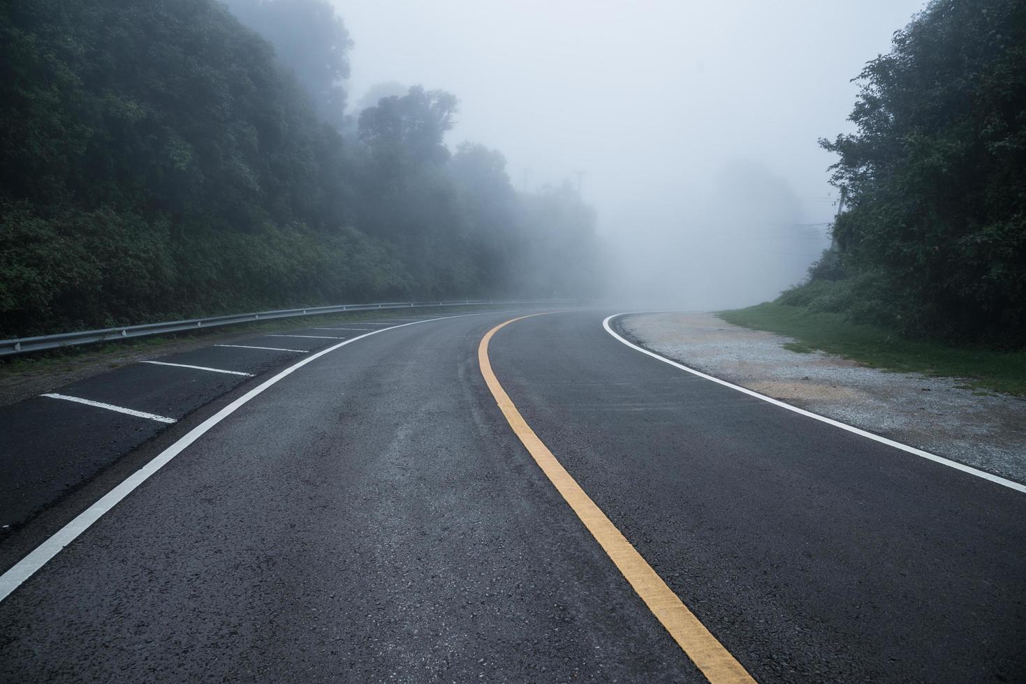 The long road through the mist on the mountains. photo