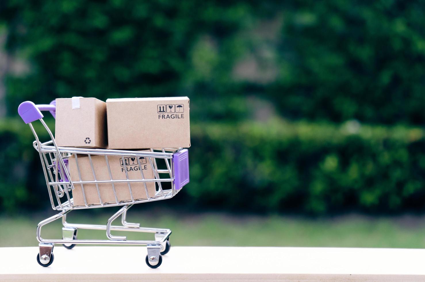 Paper boxes in a trolley with copy-space,Shopping online concept photo