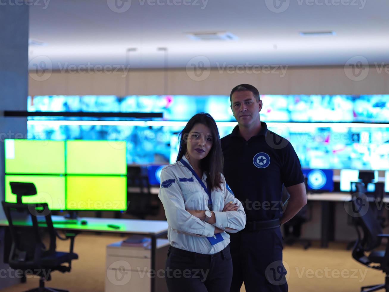 male and female operator in a security data system control room photo