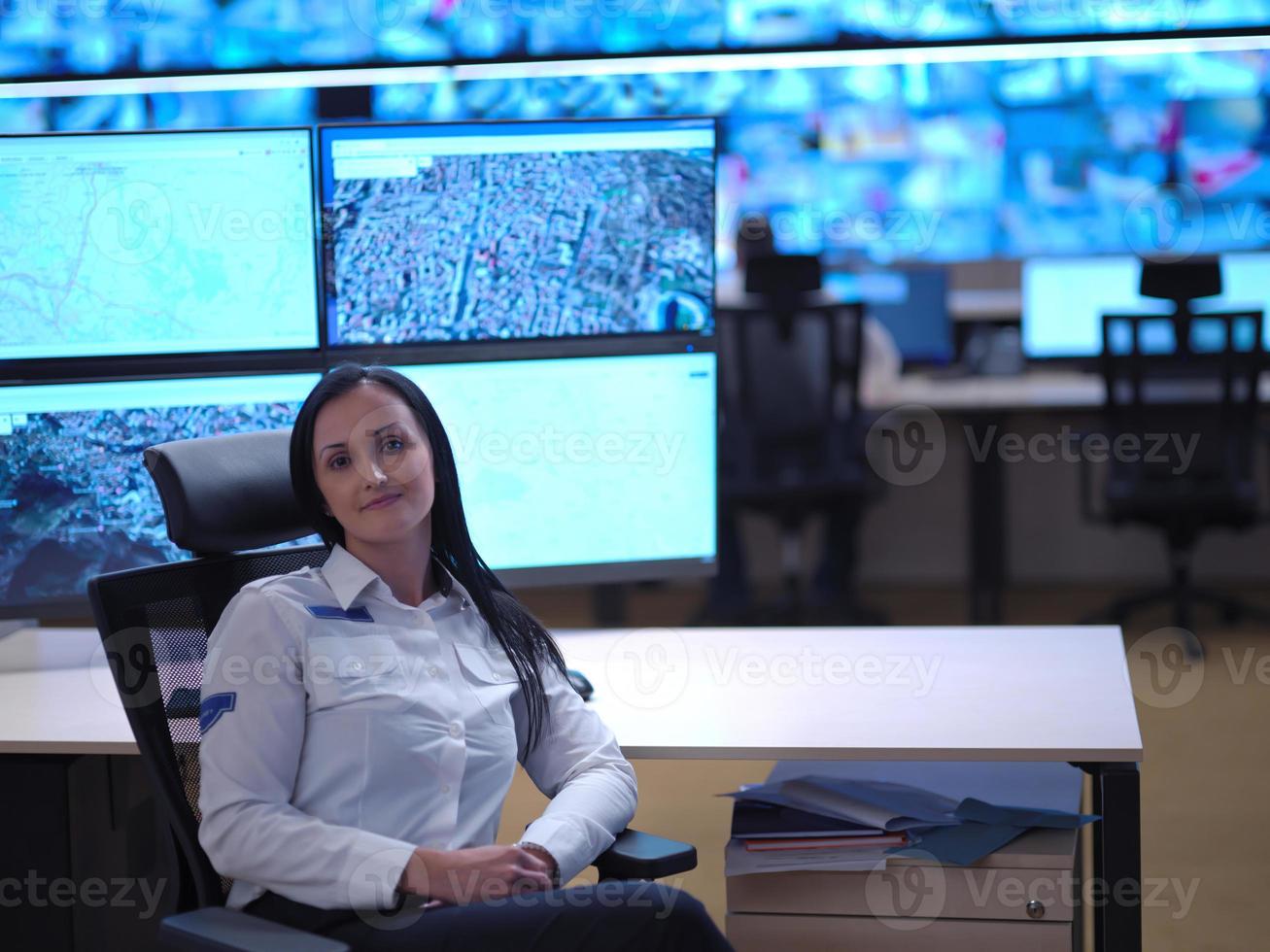 Woman operator in a security data system control room photo