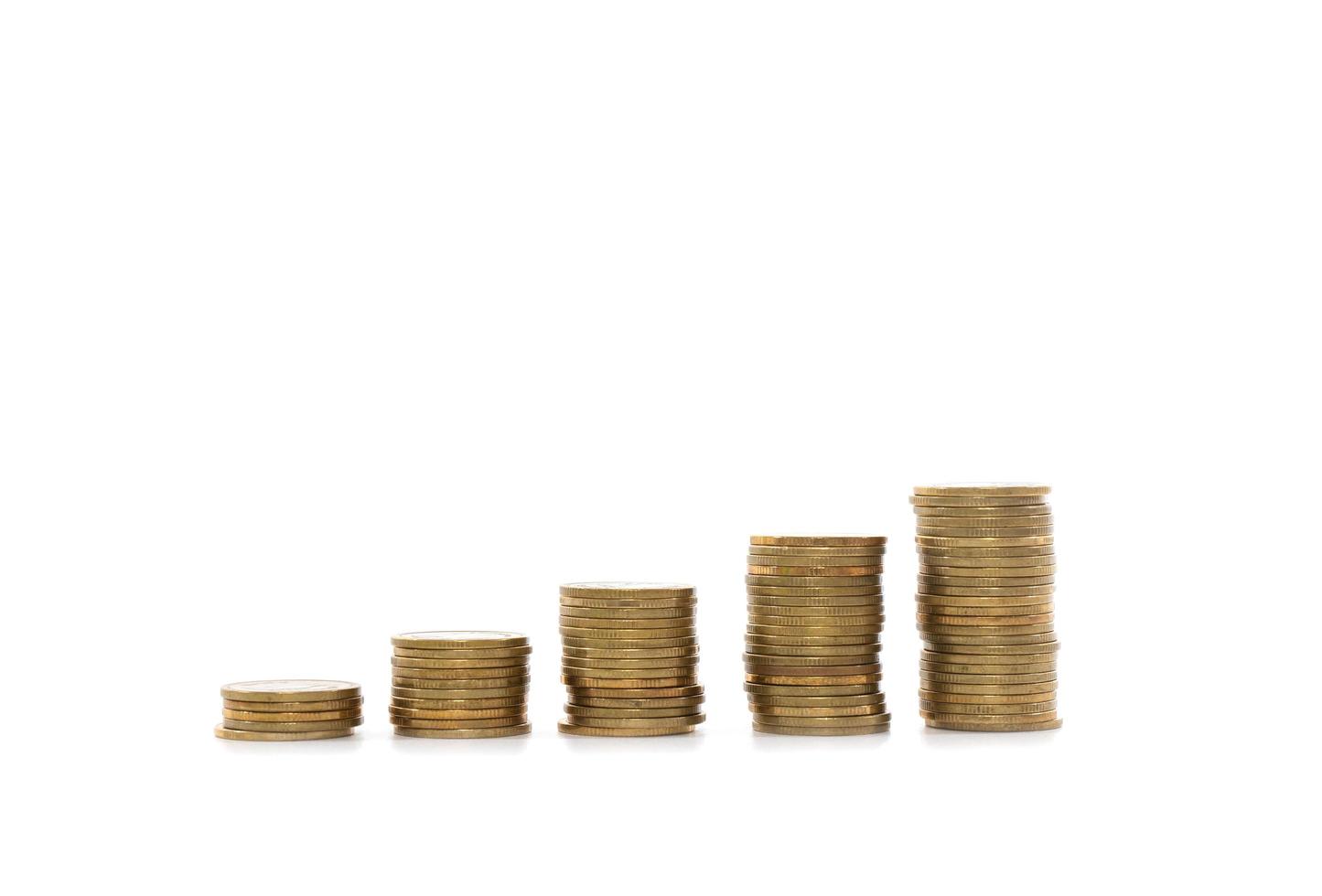 Money coin stack growing on white background photo