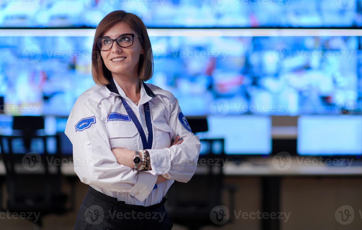 portrait of Female operator in a security data system control room photo