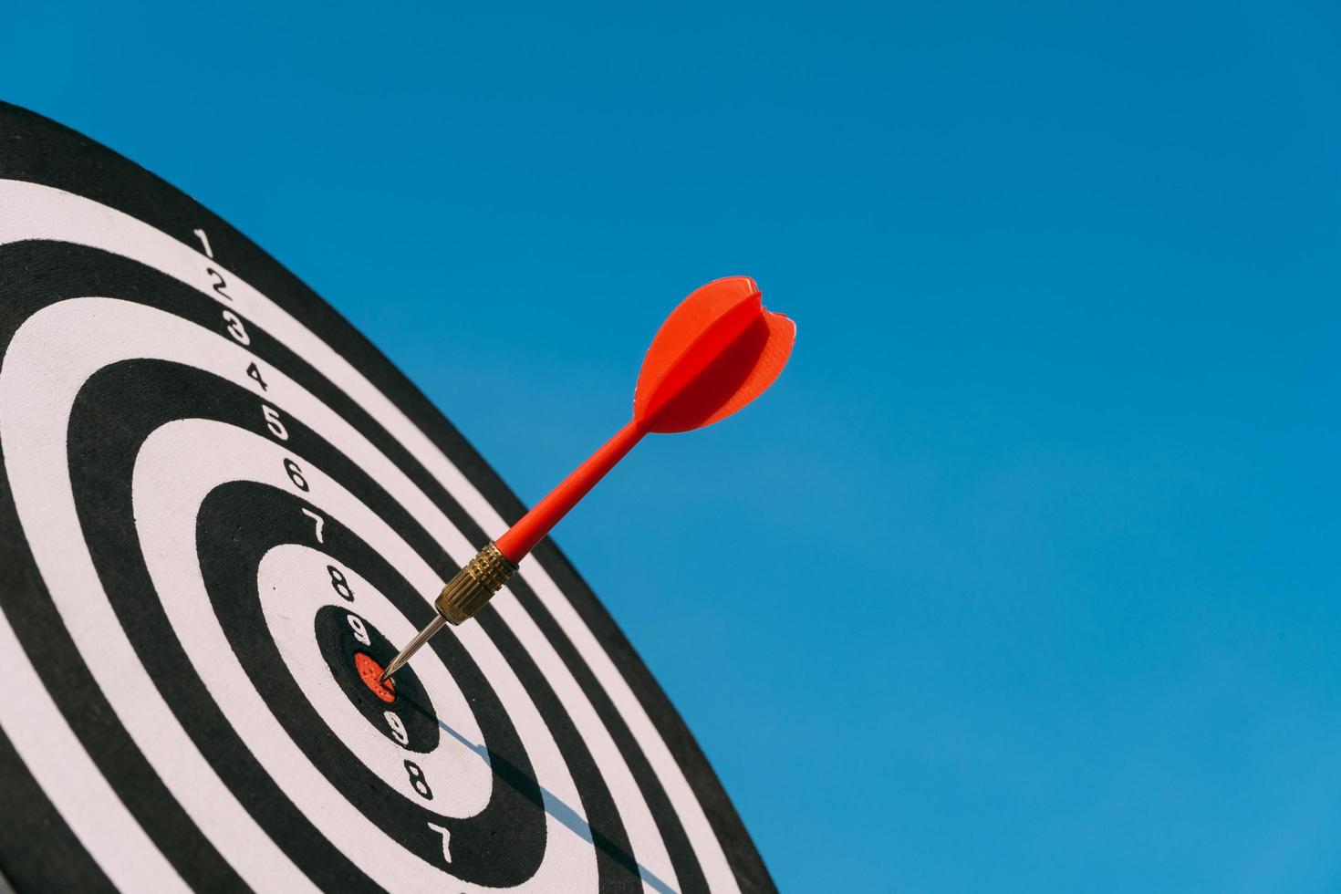 Target dart and arrow with abstract nature bokeh blur background photo