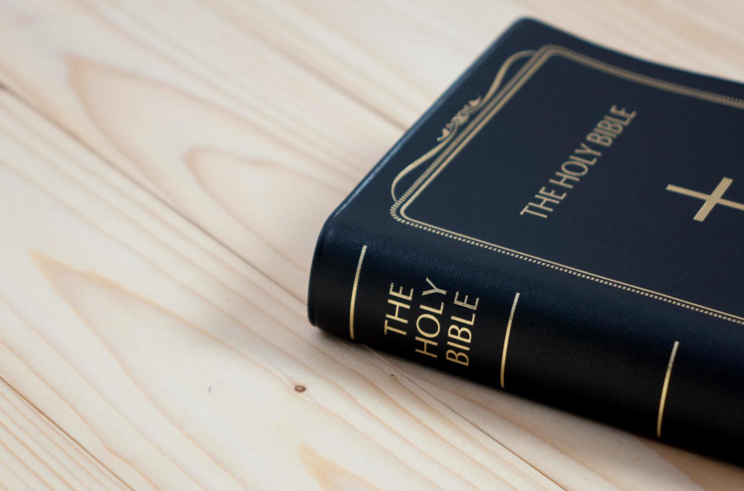 holy bible on wood table photo