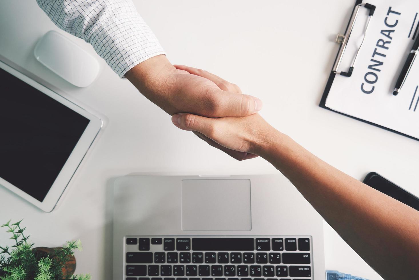 Top view of a strong handshake between man and woman photo