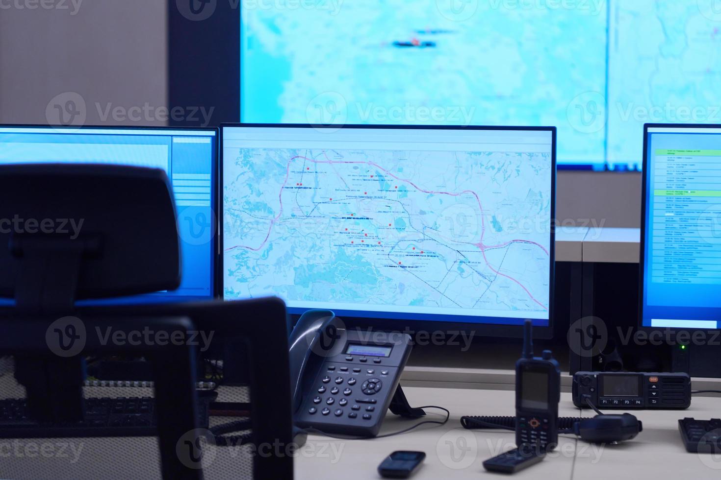 Empty interior of big modern security system control room photo