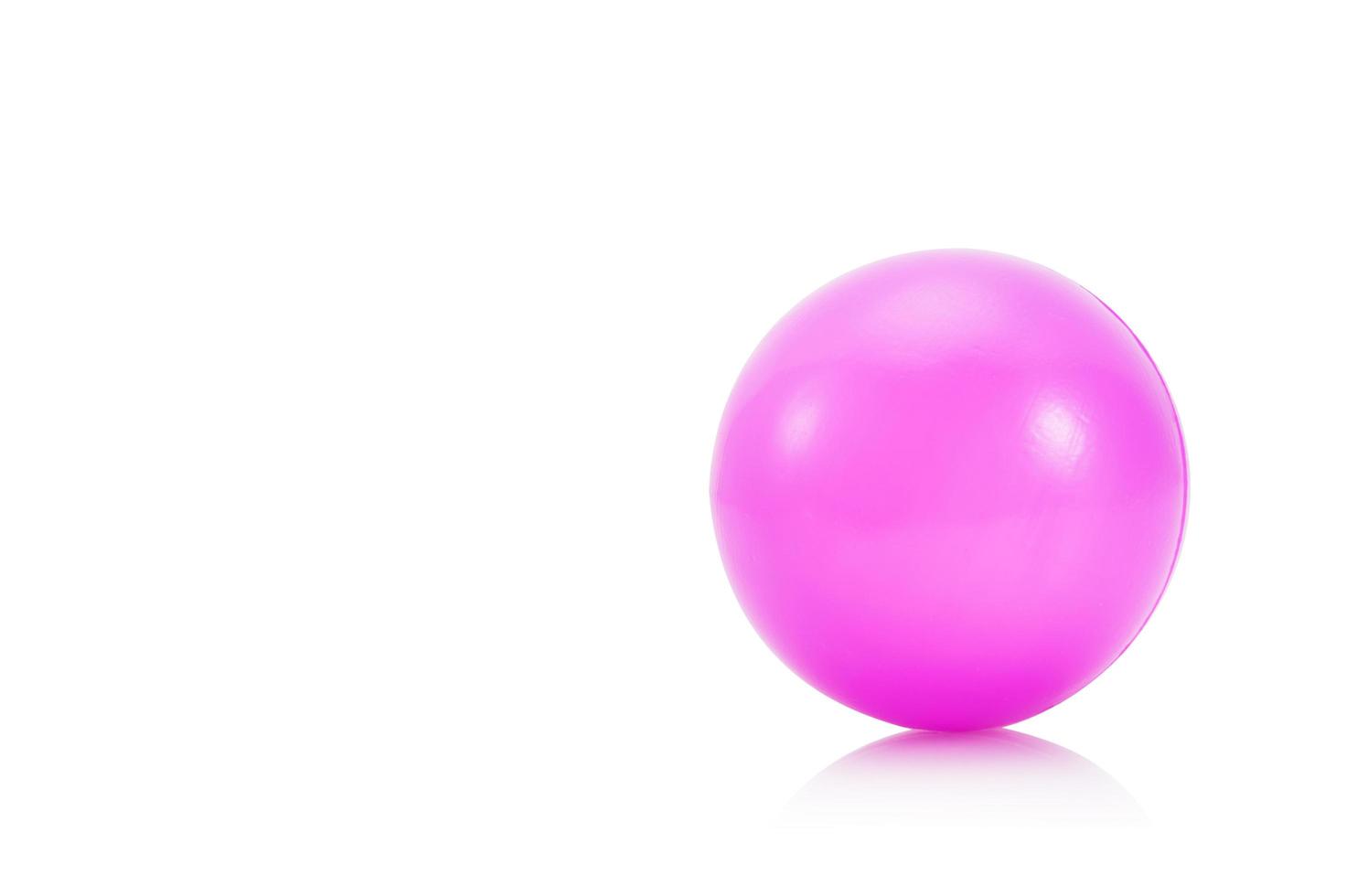 Pink stress ball on white background photo