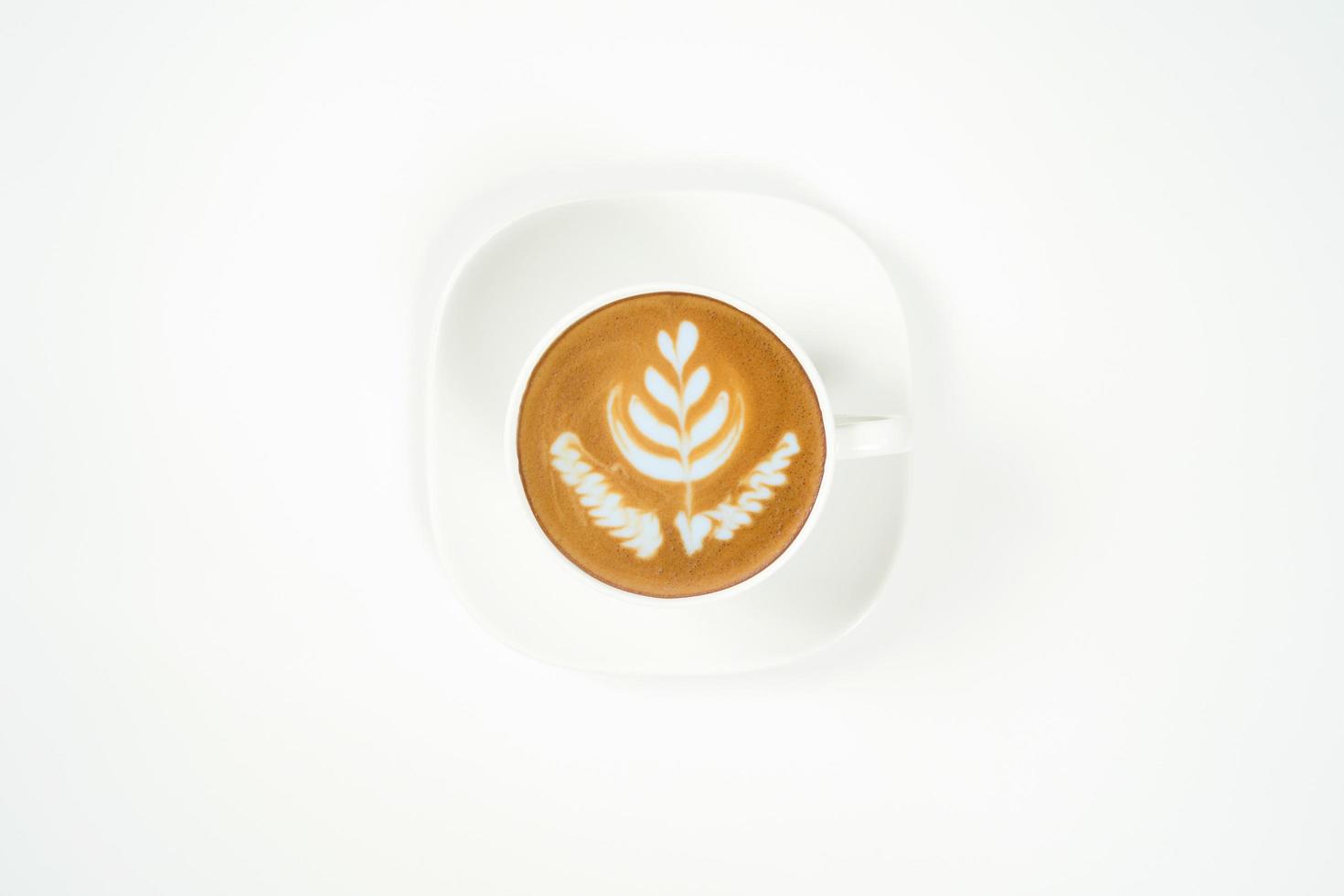 A cup of tulip latte art coffee on white background photo